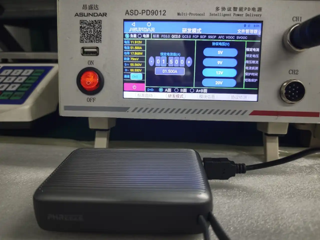 Power bank battery cell voltage and capacity testing with digital multimeter at OEM factory QC laboratory for mAh verification and Grade-A cell certification